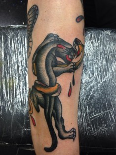 Цветная татуировка на руке «Пантера и змея»